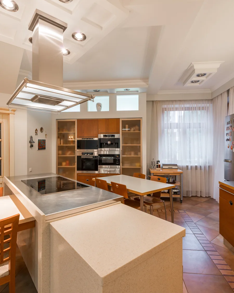 Warm evening lighting revealing texture in a white kitchen
