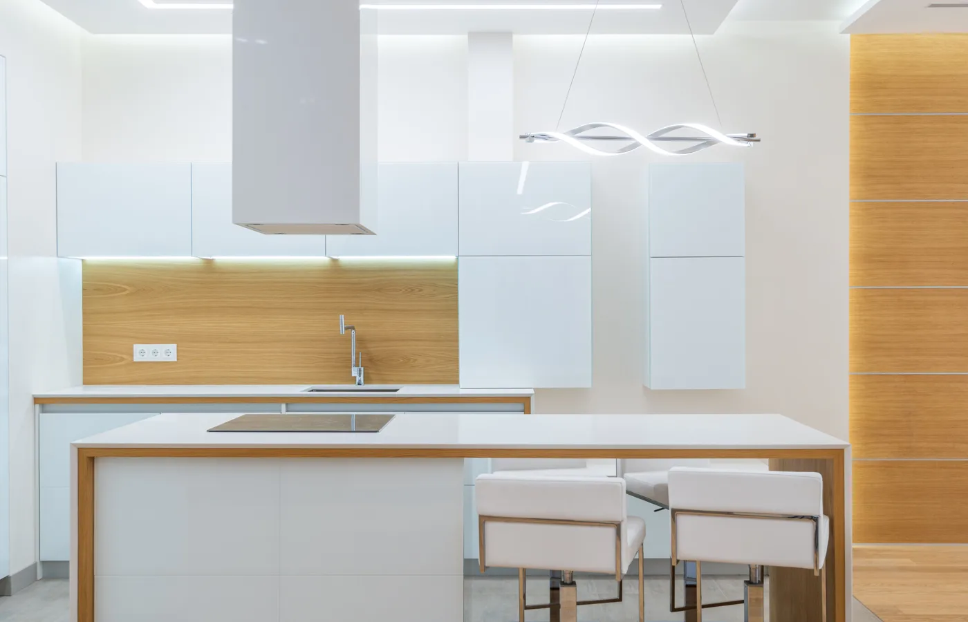 White kitchen balanced with a substantial warm natural wood element